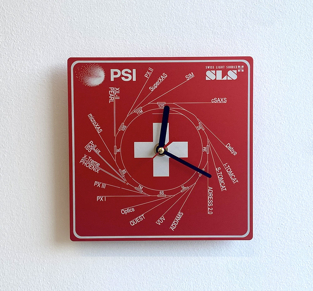 Commemorative engraved metal clock presented to outgoing SLS PRC members, featuring the layout of the SLS 2.0 beamlines